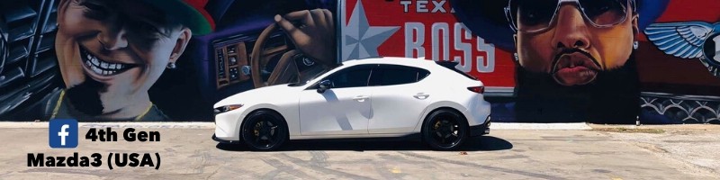 Wide view of Mazda 3 with art in back