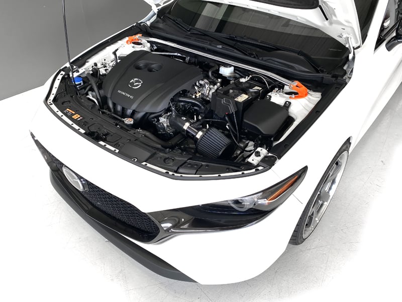 Mazda 3 with CorkSport products installed in engine bay
