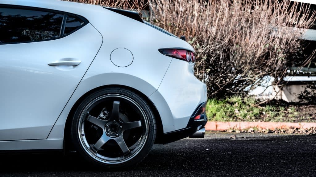 Axle Back Exhaust for 2019+ Mazda 3  installed on white Mazda 3 hatchback